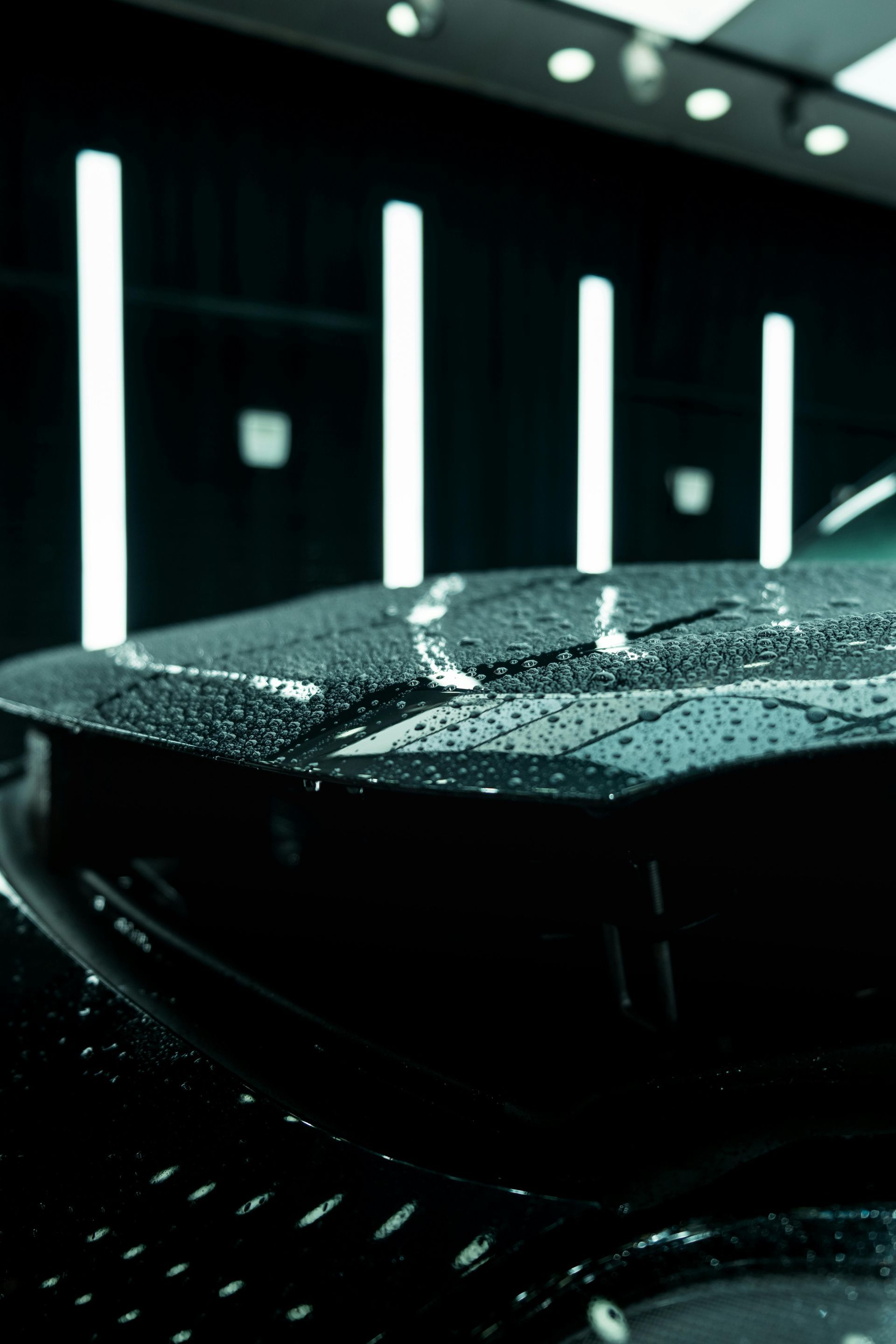 Professional ceramic coating detail on luxury sedan exterior
