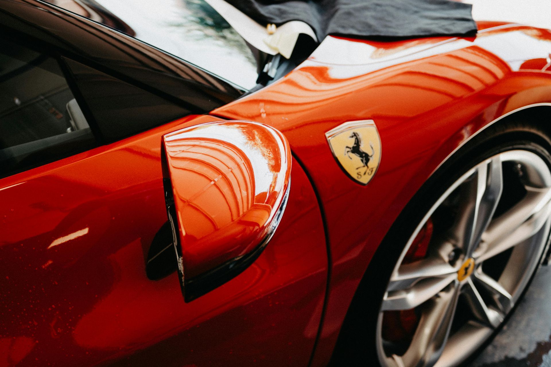 Ferrari receiving professional paint correction for enhanced gloss and flawless paint clarity. Ferrari receiving professional paint correction to remove swirl marks and restore deep gloss, clarity, and shine.