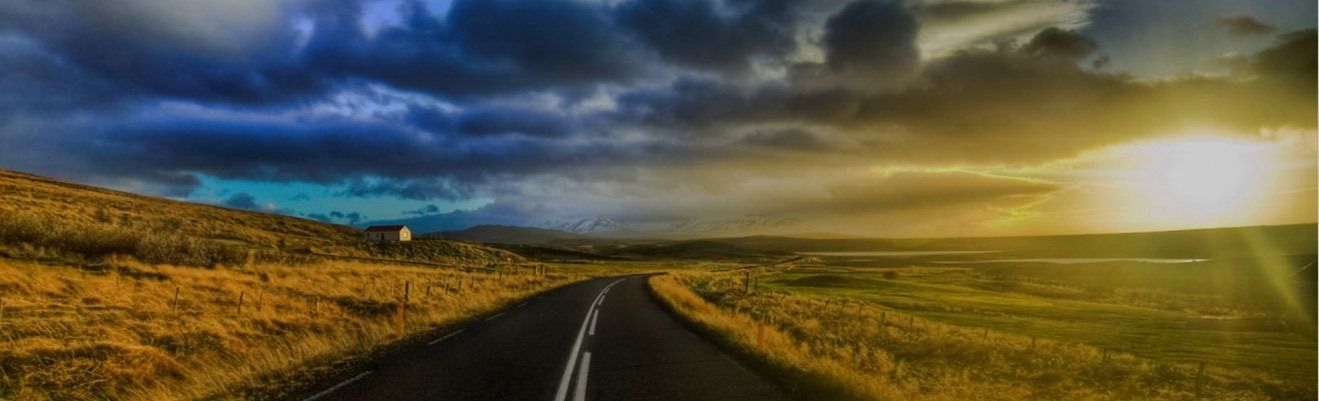 A man , woman and child are hugging each other and smiling.