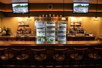 A church with rows of wooden benches and a podium
