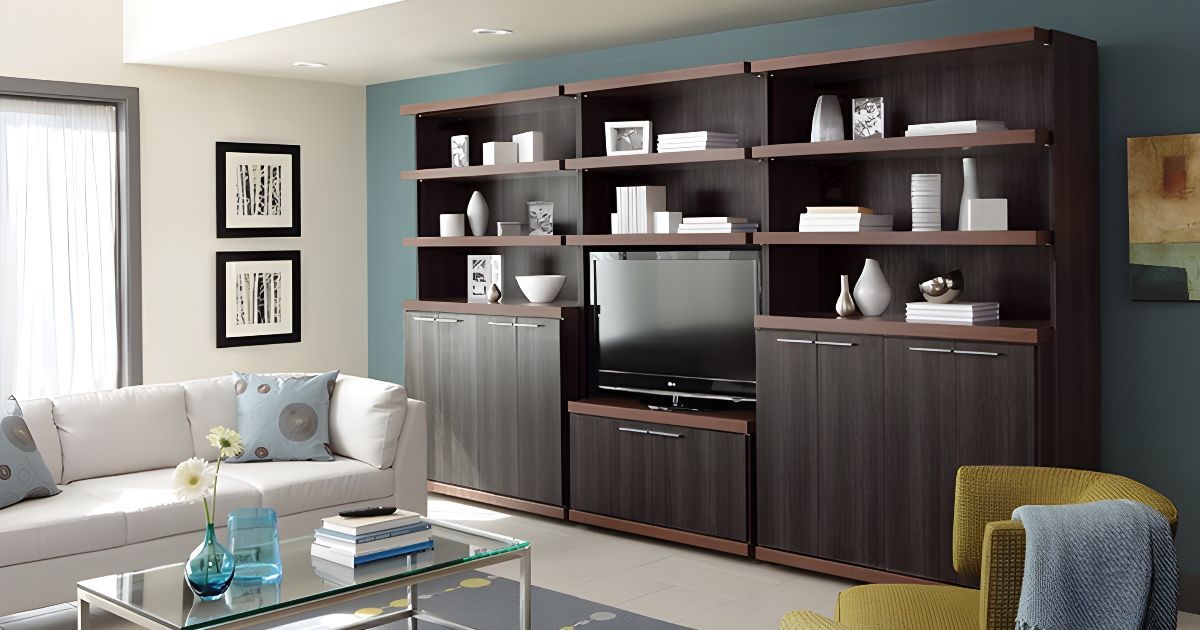 A living room with a couch , chairs , shelves and a television.