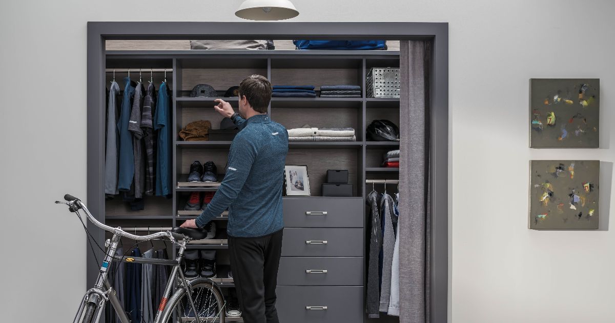 a bedroom with a walk in closet and a bed
