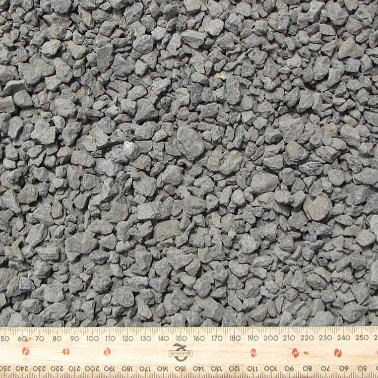 Gray Gravel Aggregate Pile With Ruler at Bottom — Kuranda Landscape Supplies in Kuranda, QLD