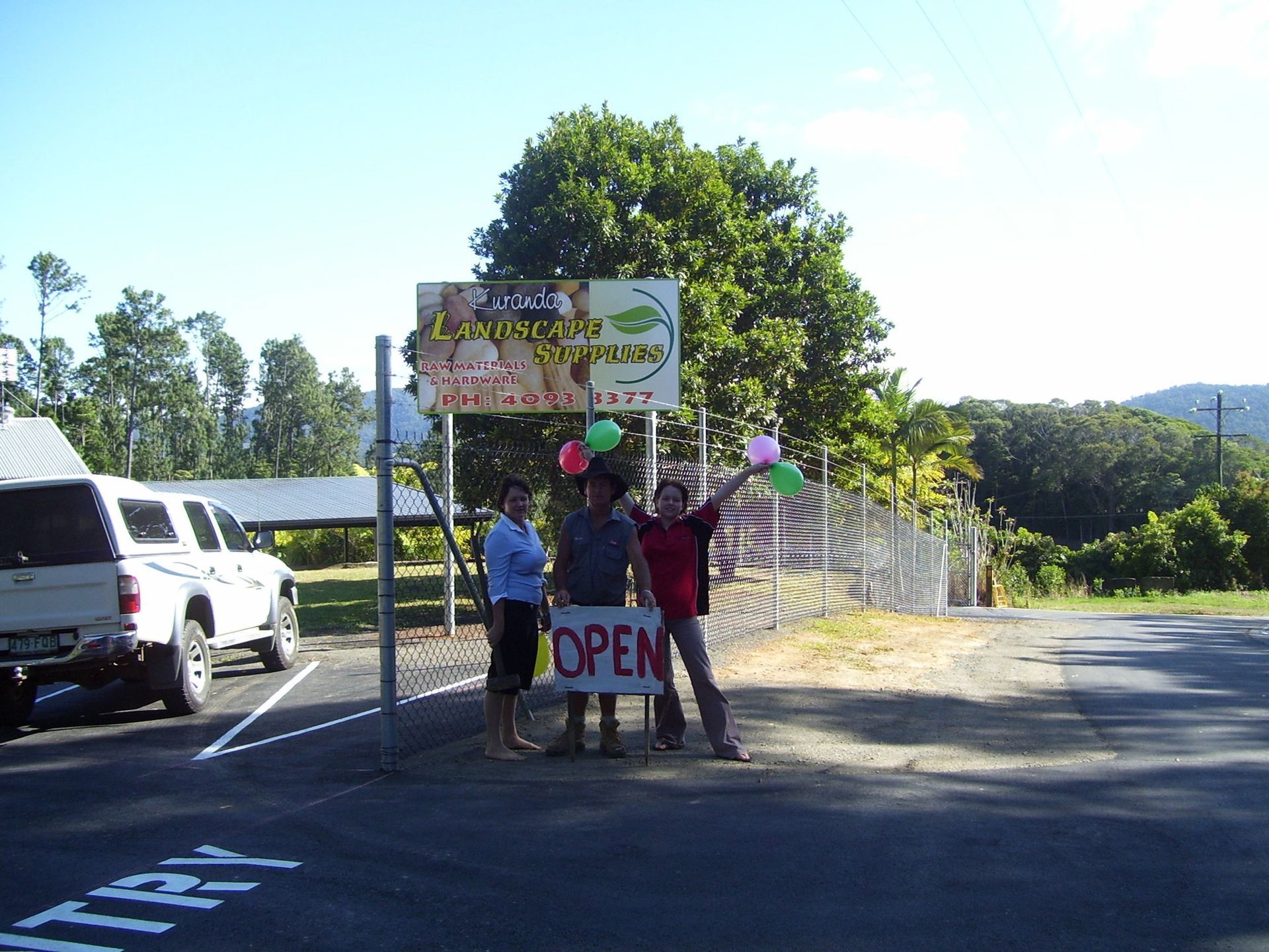Three People Holding an