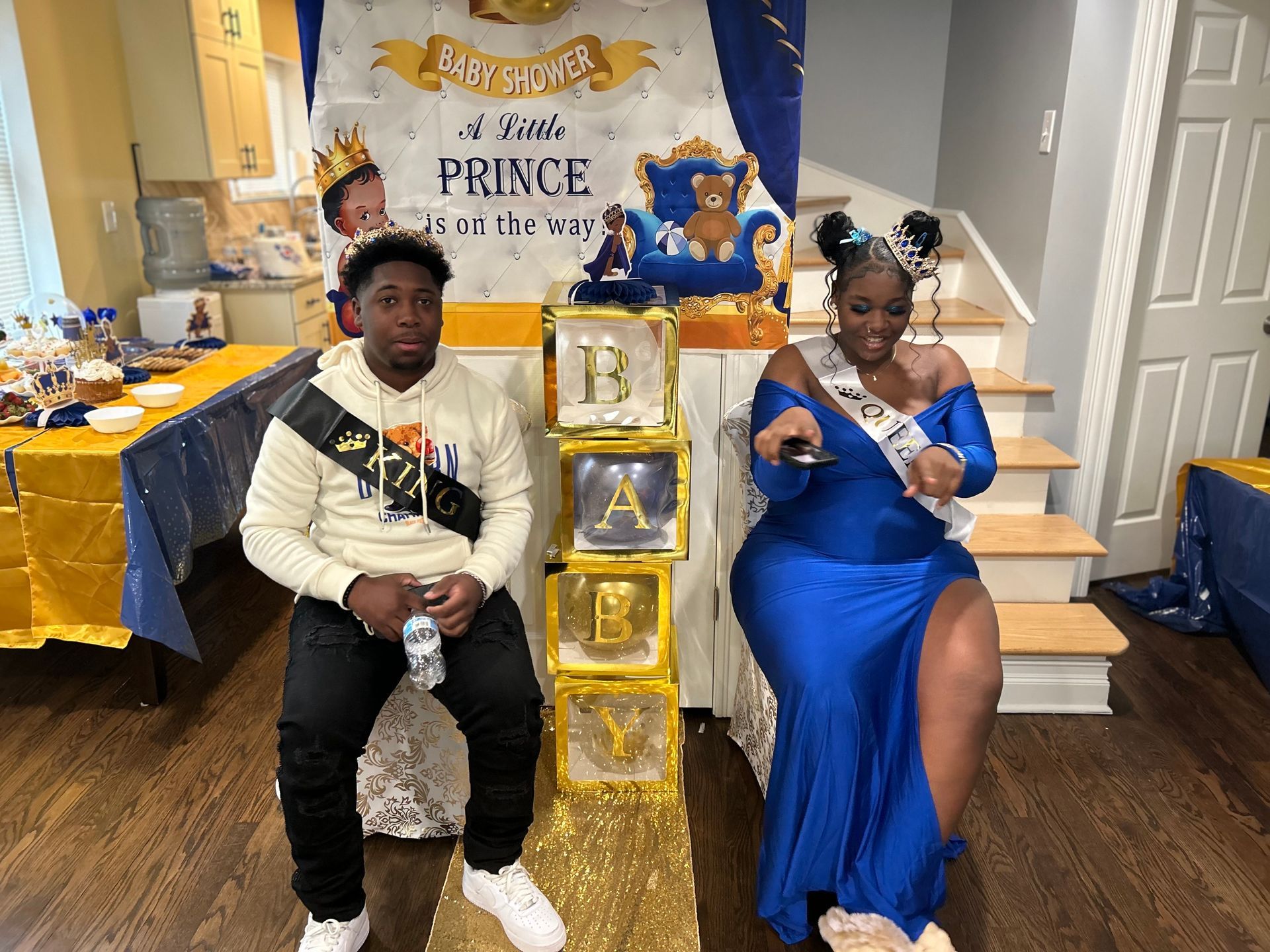 People celebrating with sparklers and champagne glasses in a dimly lit setting.