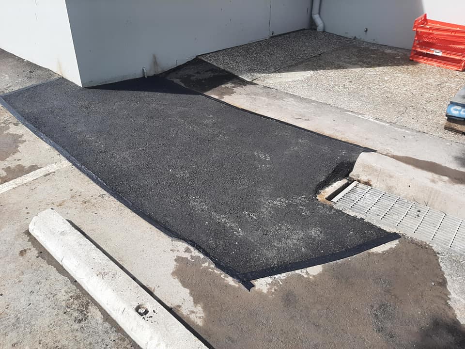 Damaged Pavement Patched Up With Asphalt — Asphalt Surfacing in Port Stephens, NSW