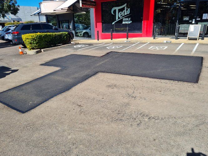 Pothole Repairs in the Car Park — Asphalt Surfacing in Port Stephens, NSW