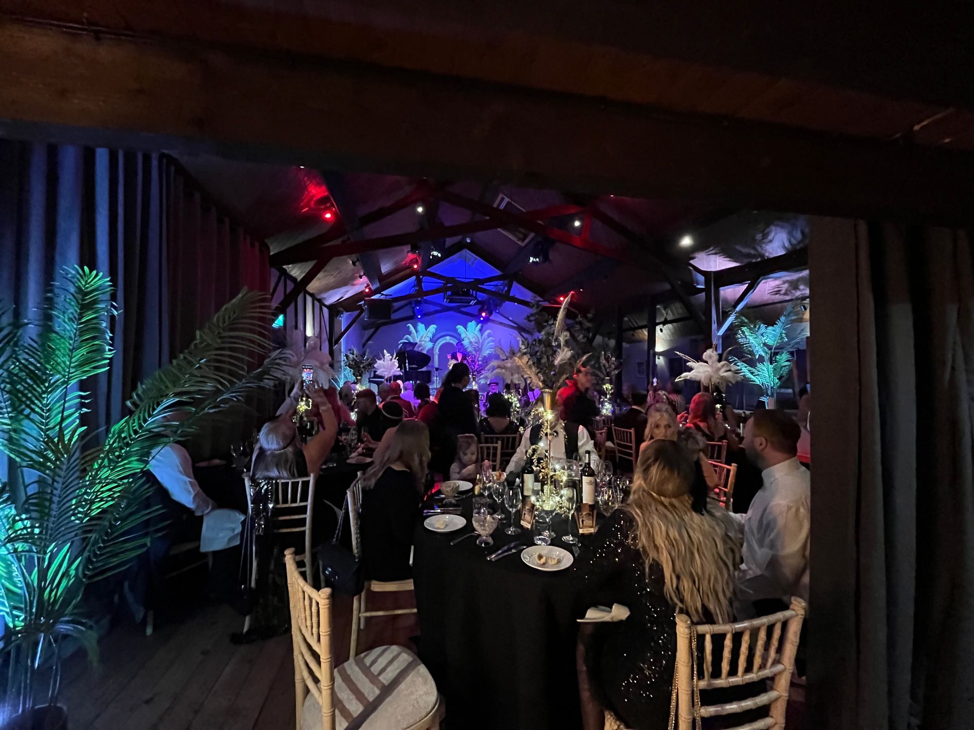 A large room with a lot of people sitting at tables