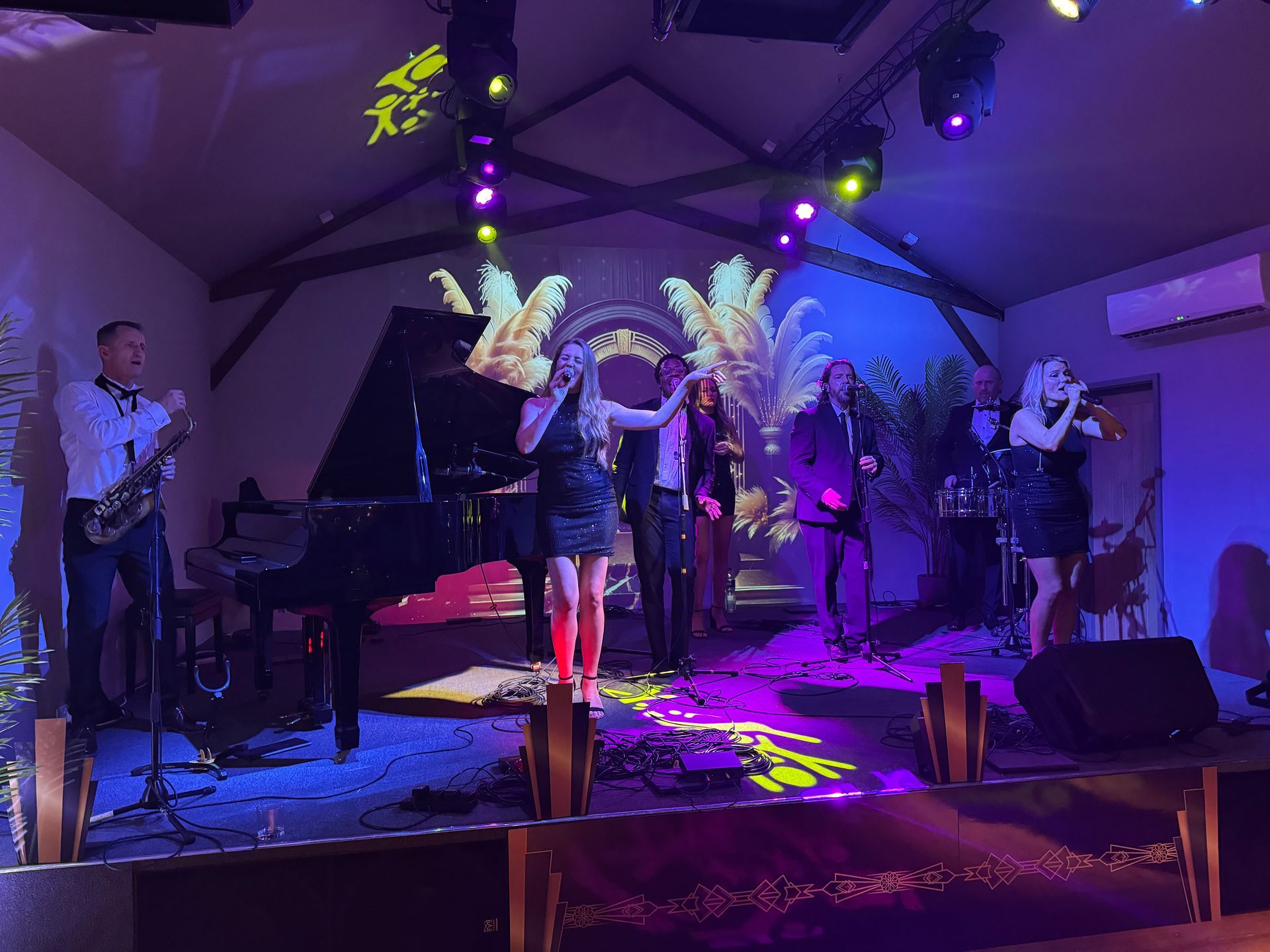 A group of people are playing instruments on a stage