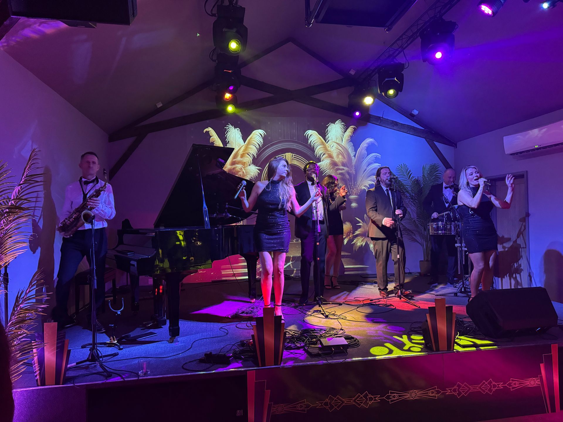 A group of people are playing instruments on a stage