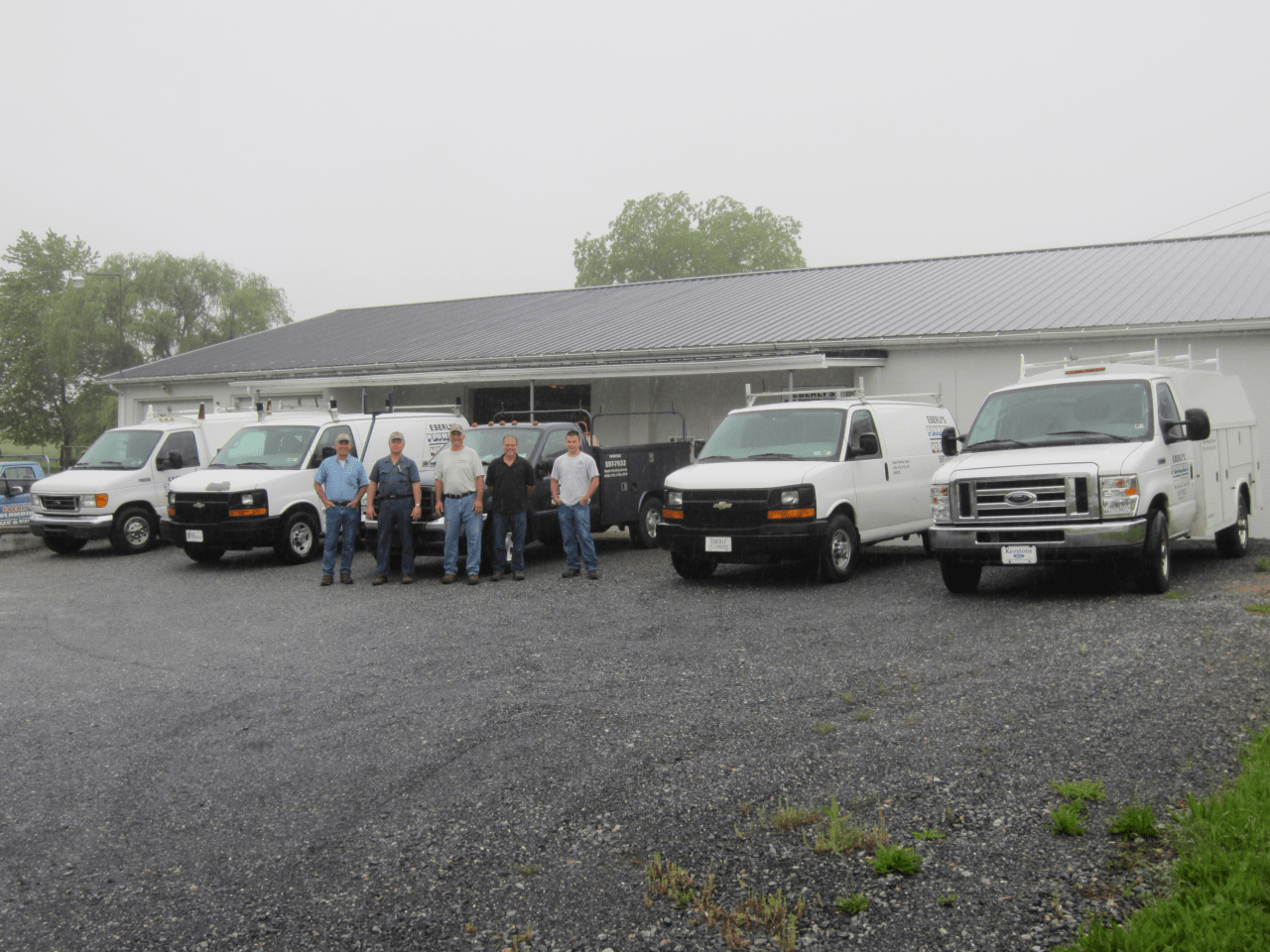Eberly's Plumbing & Heating staff and repair vehicles