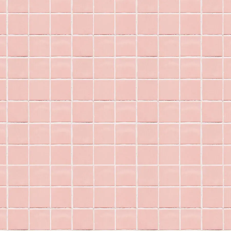 A seamless pattern of pink square tiles on a wall.