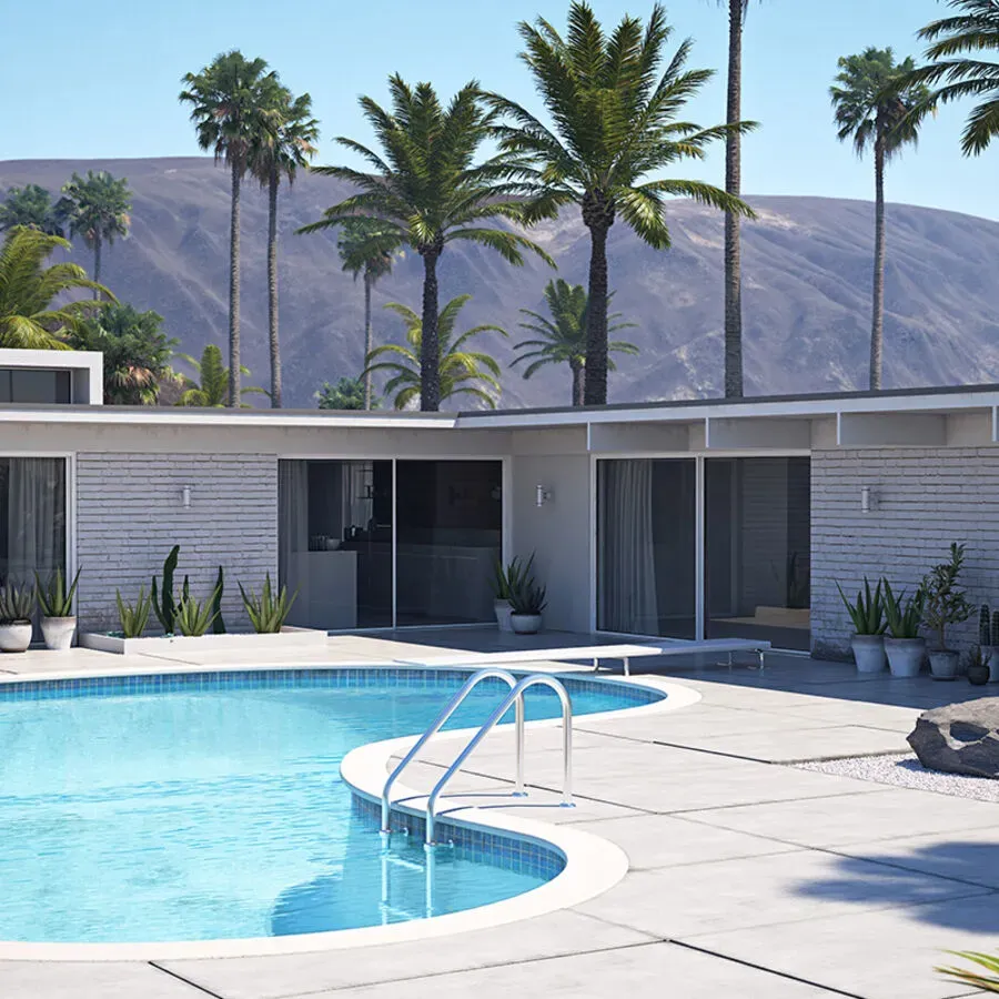 A large swimming pool in front of a house with palm trees in the background