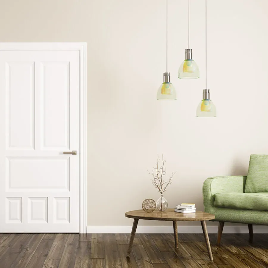 A living room with a green couch , table , and lamps.