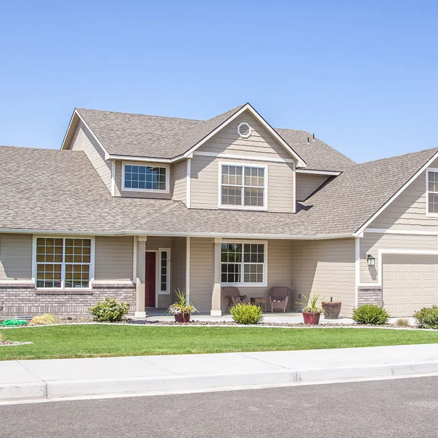A house with a lot of windows and a gray roof