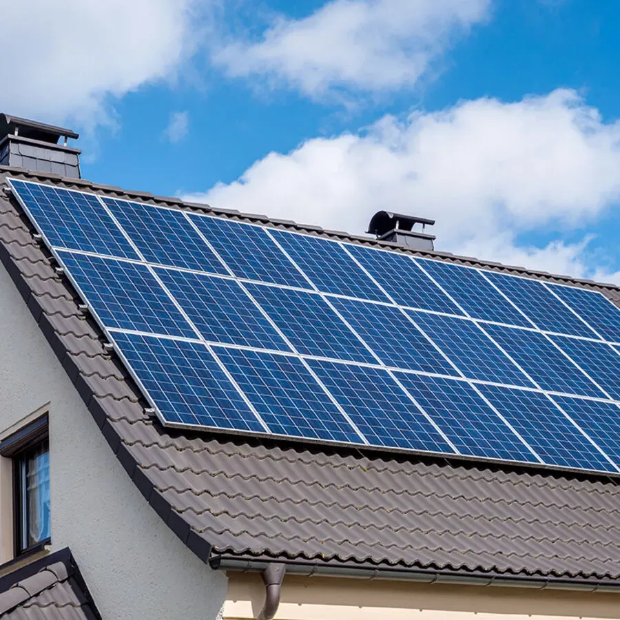 A house with a lot of solar panels on the roof