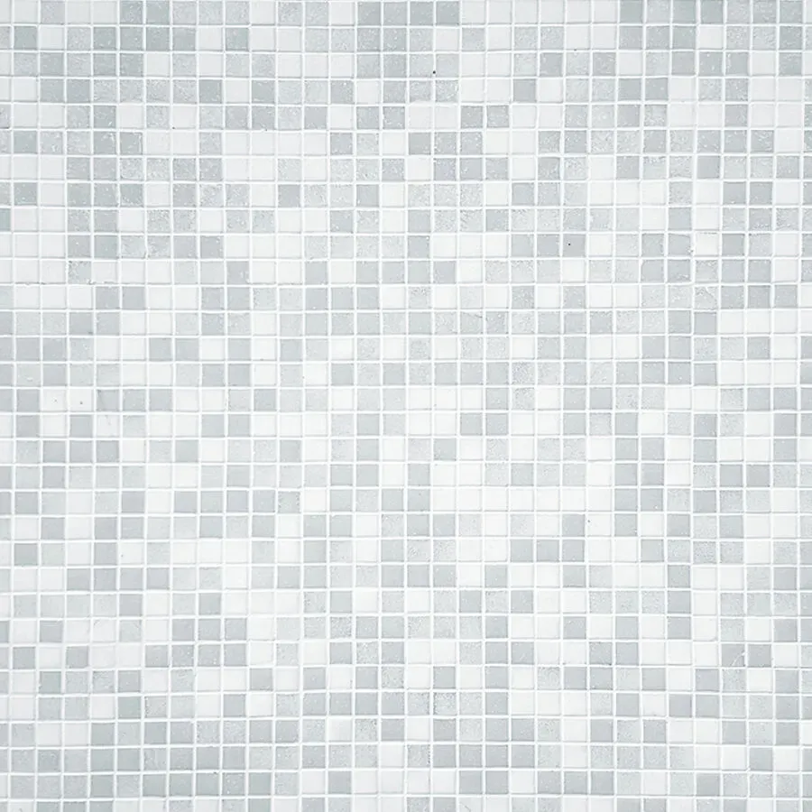 A close up of a white mosaic tile wall.