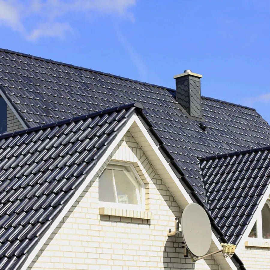 A house with a satellite dish on the side of it