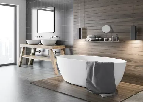 A bathroom with a bathtub , sinks , mirror and window.
