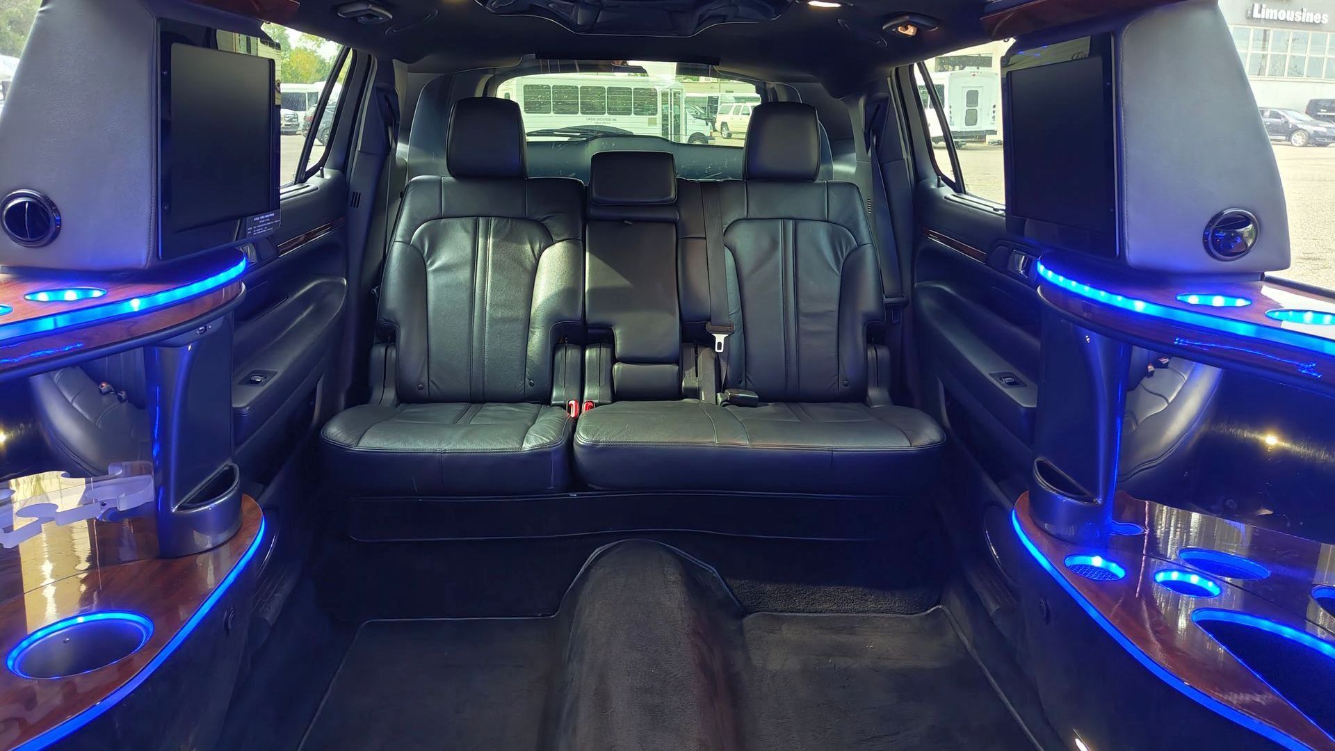 The rear seats of a car are shown in a close up.