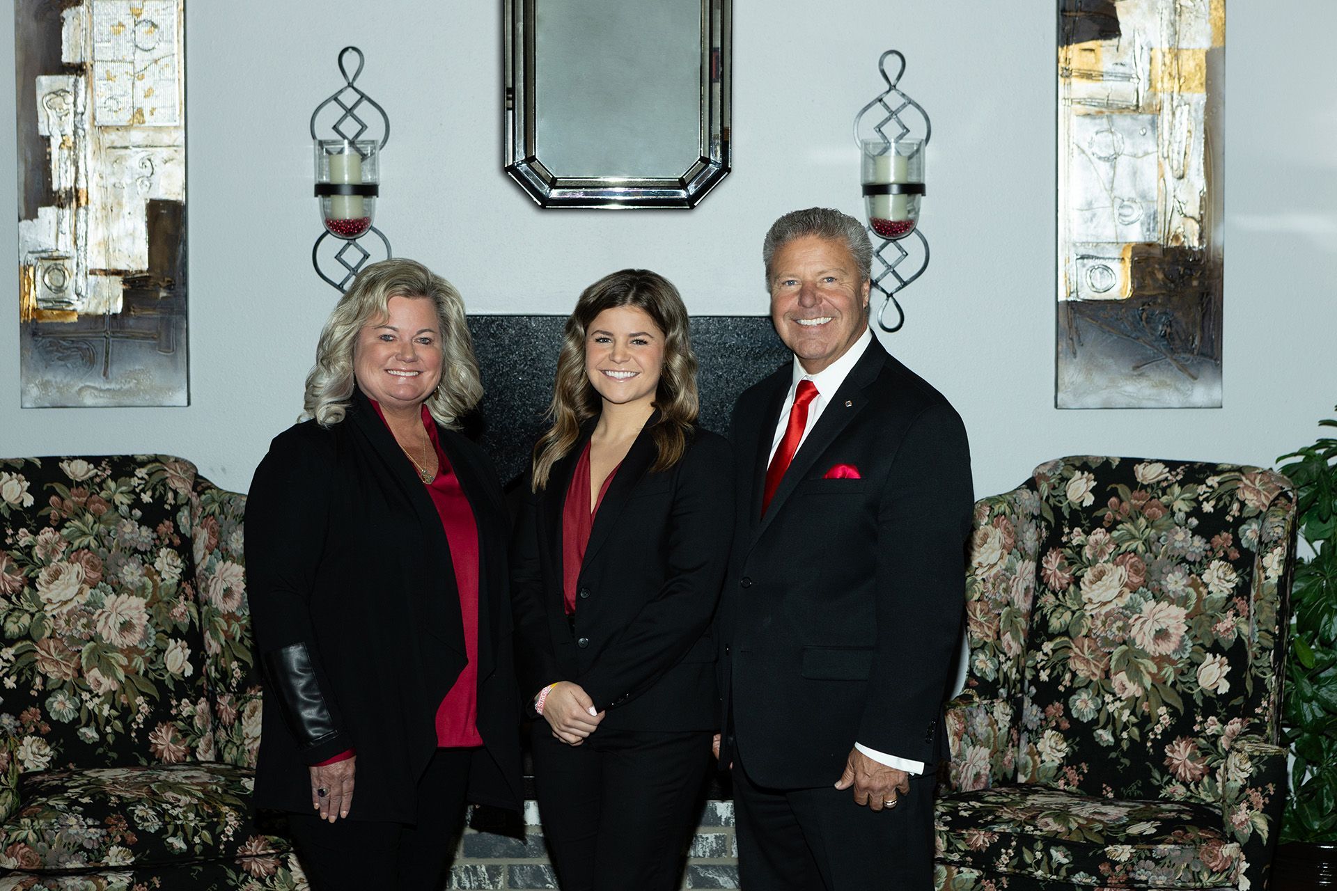A fountain in a park with palm trees in the background