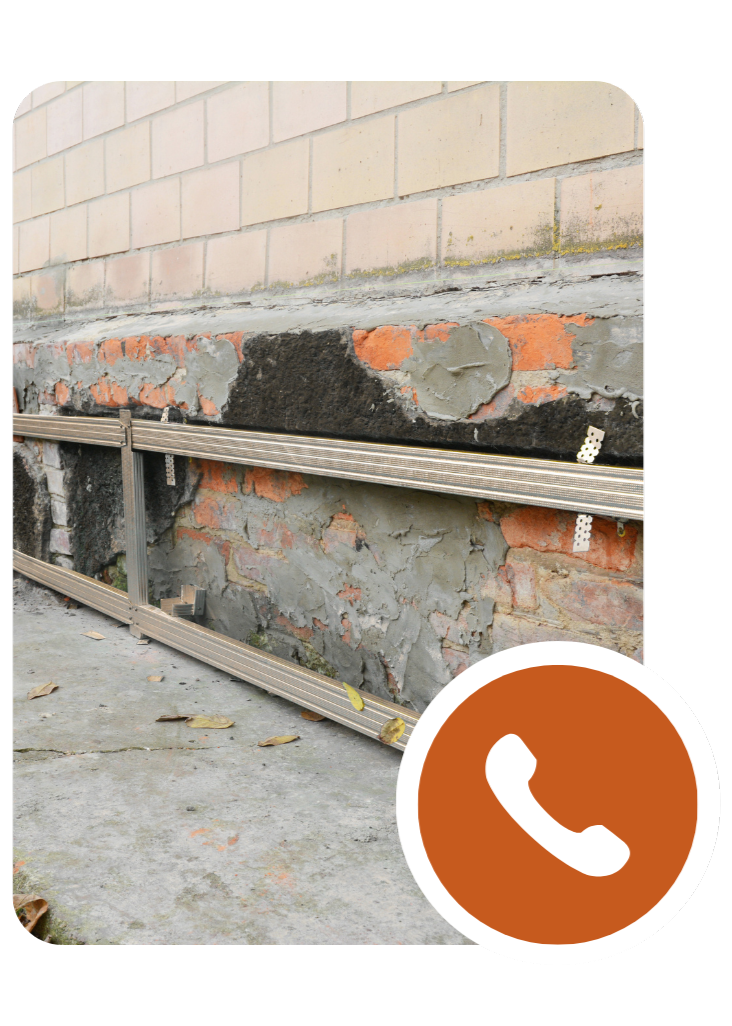 Basement waterproofing company installing moisture barrier and drainage system