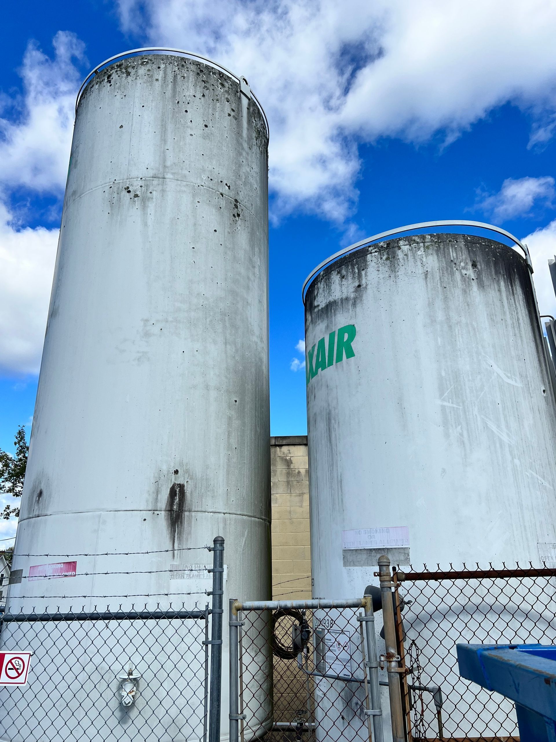 Two large white tanks with the word air on them