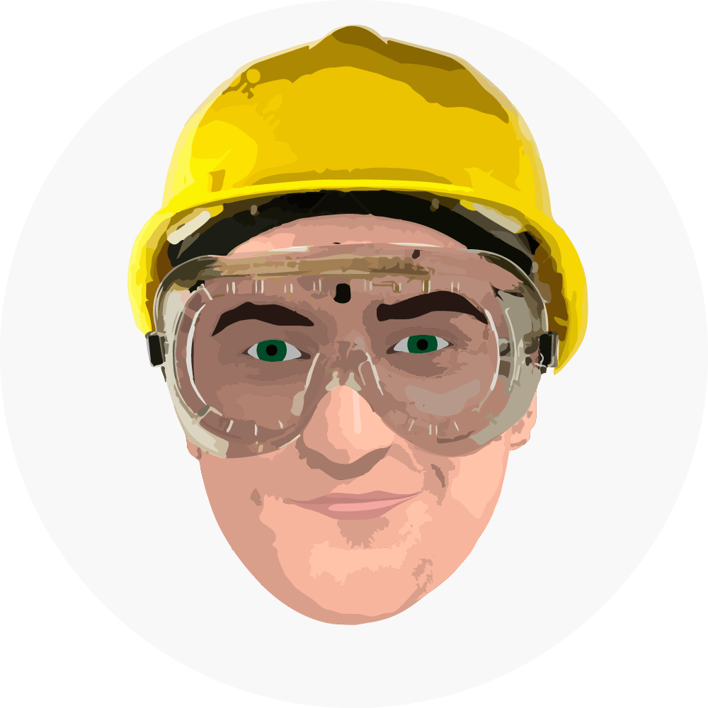 A man wearing safety goggles and a hard hat