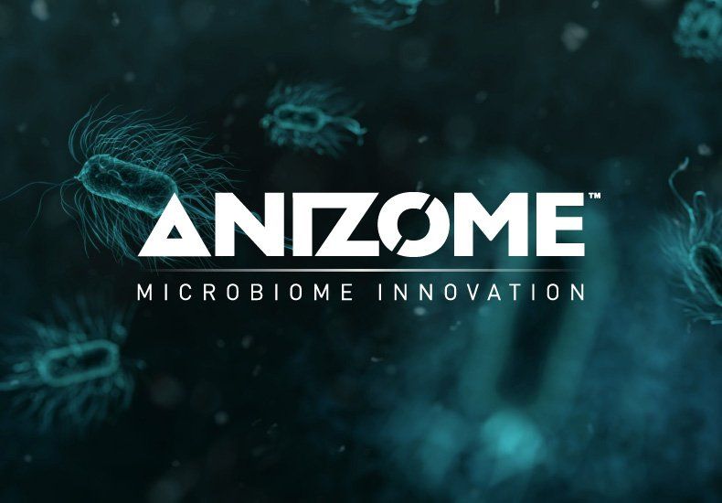A logo for anizome microbiome innovation with bacteria in the background