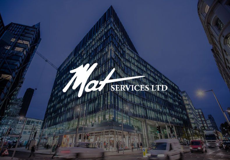 A large building with the mat services ltd logo on it