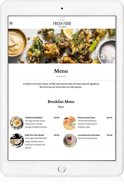 A tablet with a menu on it and a picture of food on it.
