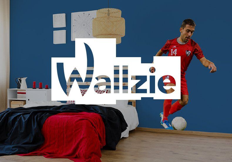 A wall with a picture of a soccer player and the word wallzie