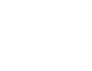 A digital illustration of a yellow lightbulb containing a miniature, cozy furnished room with a chair, rug, and lamp.