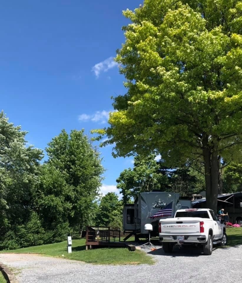 Top Section of RV Parking Has a Deck & Picnic Table to Enjoy