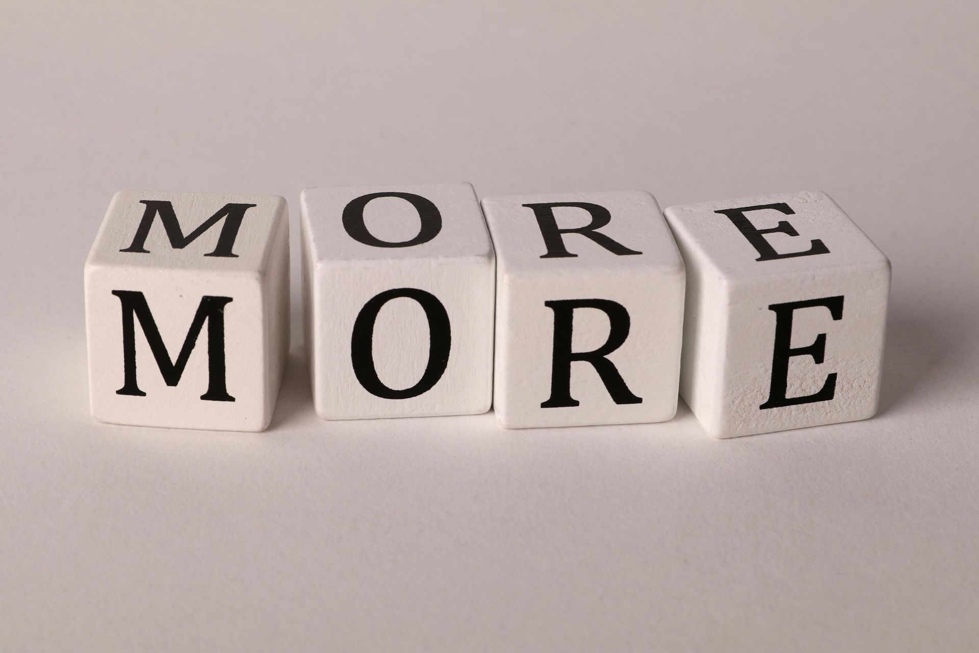 The word more is written on a white block