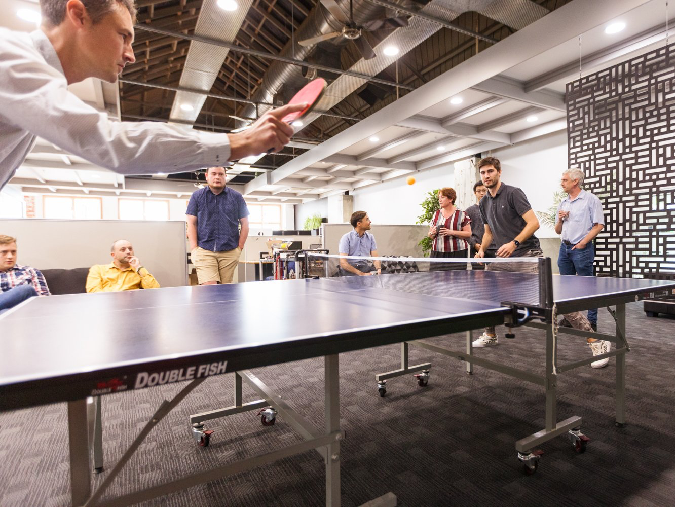 A game of table tennis played inside Beta Solutions' office.