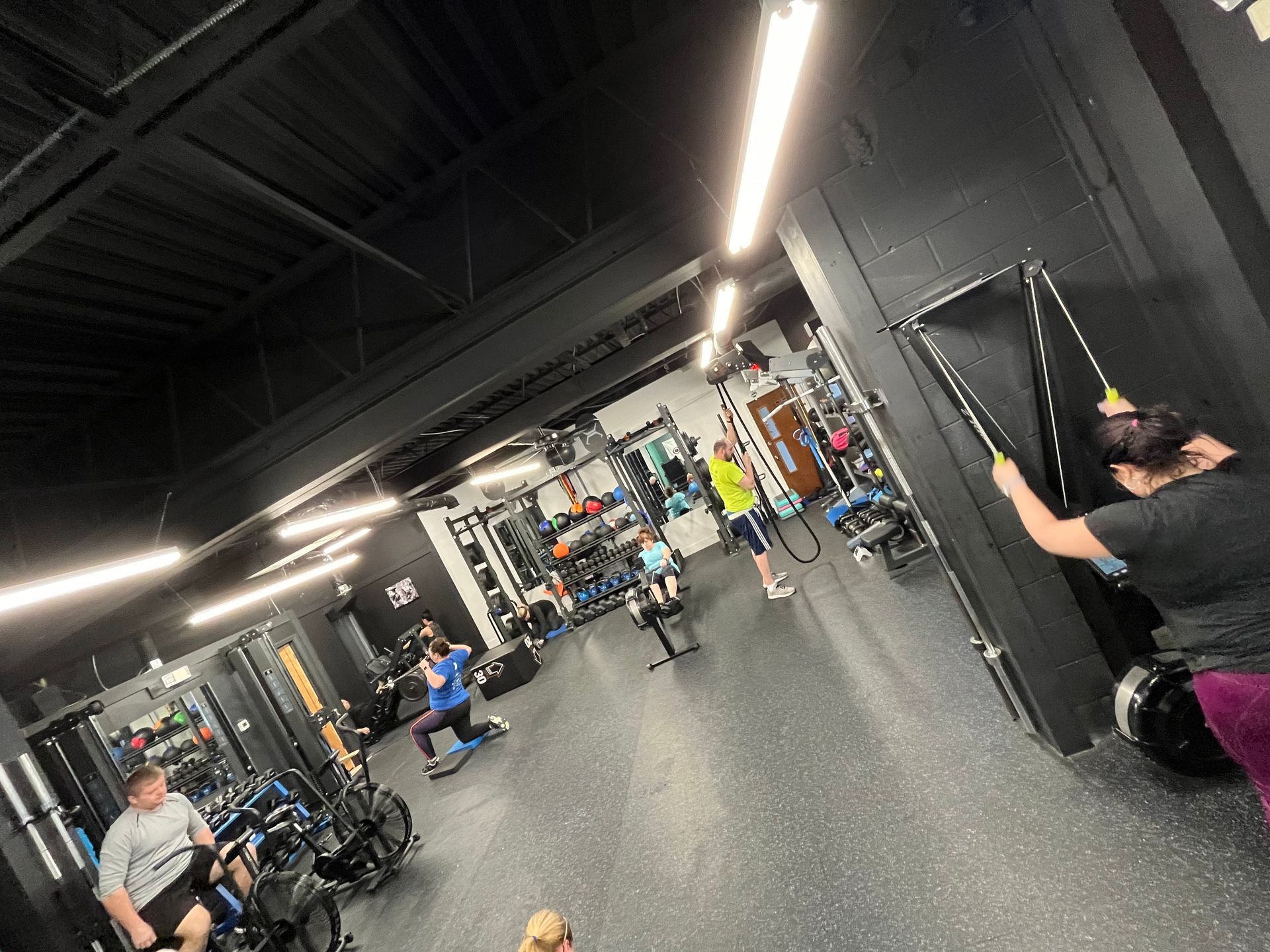 A group of people are working out in a gym.