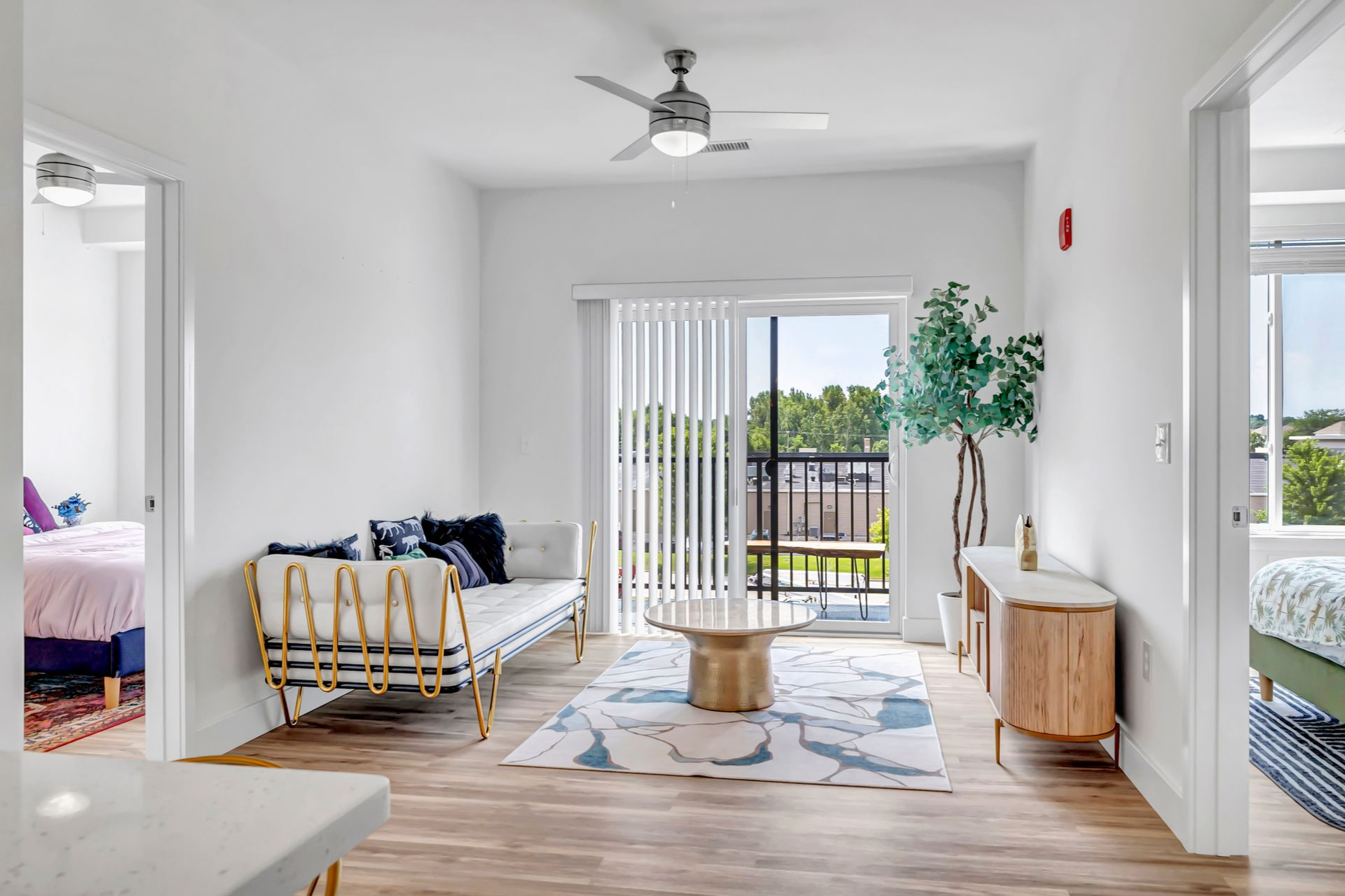 Woman sitting at a table looking at her laptop