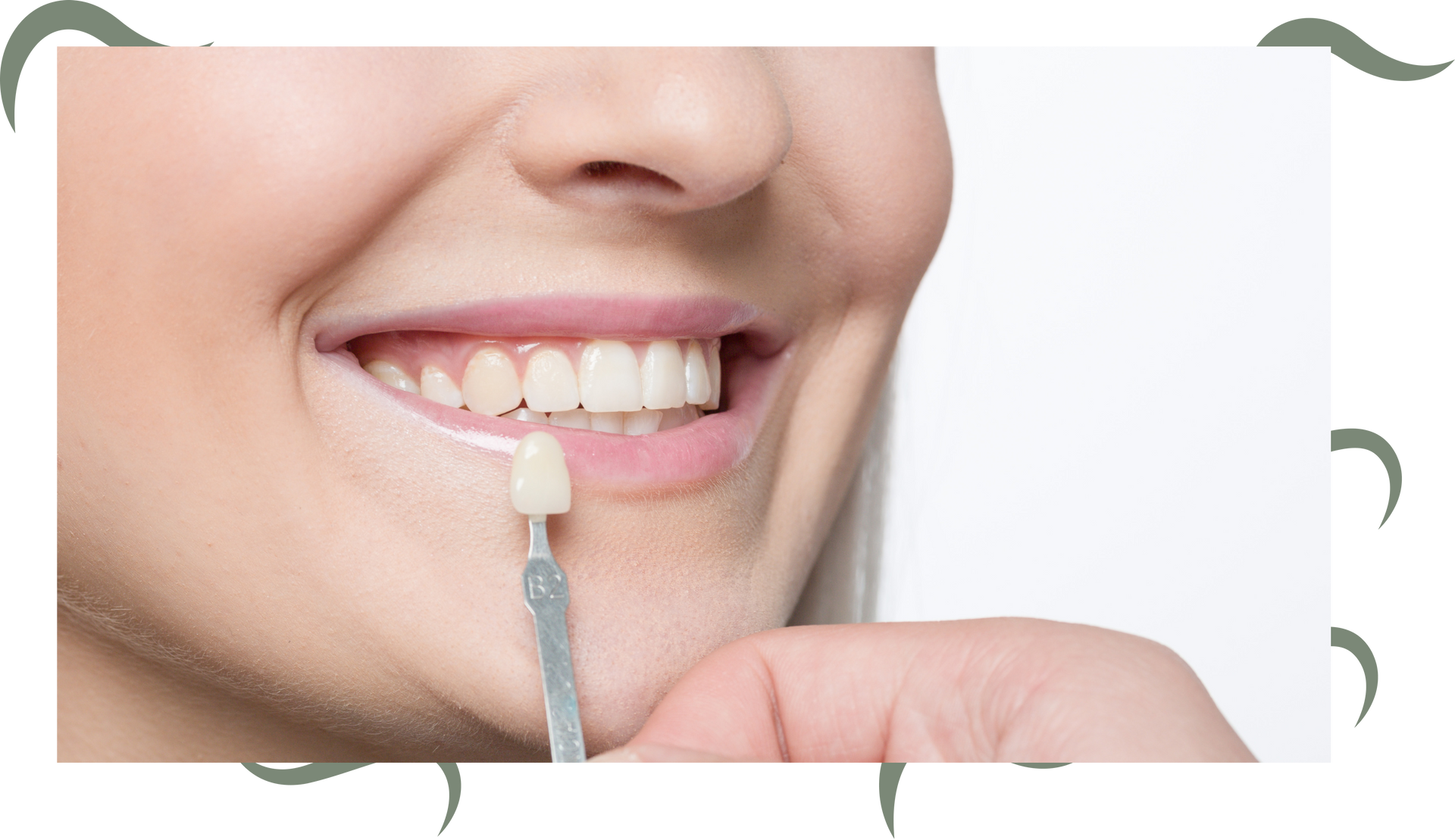 a woman is holding a tooth shade in front of her teeth .