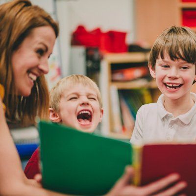Preschool Program — A Boy Laughing With Her Teacher In Stratford, NJ