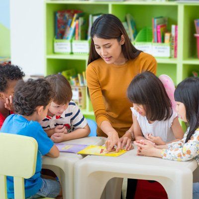Preschool — A Woman Teaching Kids To Read In  Stratford, NJ