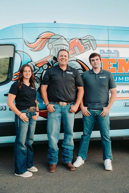 Two Plumbers working on a sink