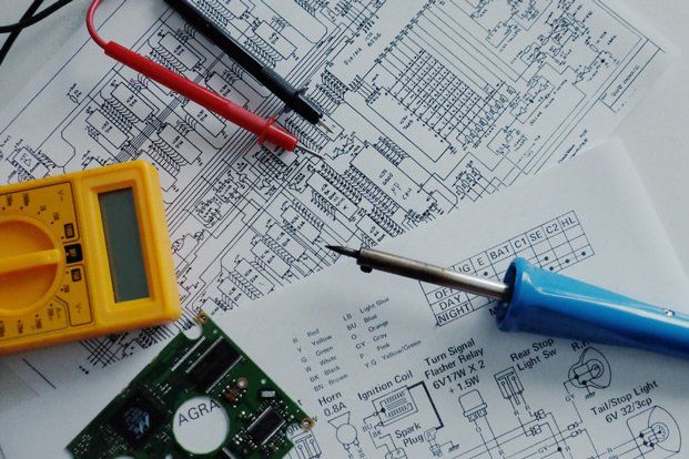 Electrical Tools Over the Electrical Diagram — Residential Electrician in Sunshine Coast, QLD