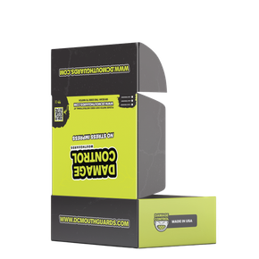 Cardboard box with DAMAGE CONTROL branding; black and lime green, open.