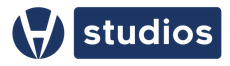 This is an image of a blue logo with the words studios in a rectangle and the company logo to the left of it. It is navy blue in color
