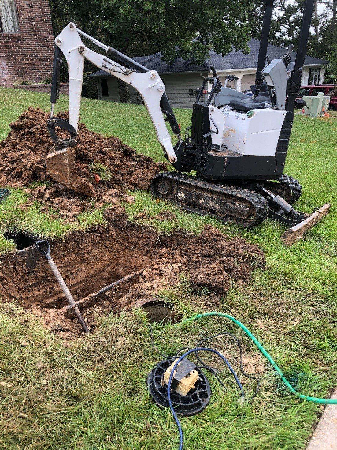 Mini Backhoe Machine — Jefferson City, MO — Bill Binkley & Sons Excavating