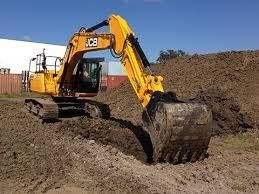 Backhoe is Digging the Soil — Jefferson City, MO — Bill Binkley & Sons Excavating