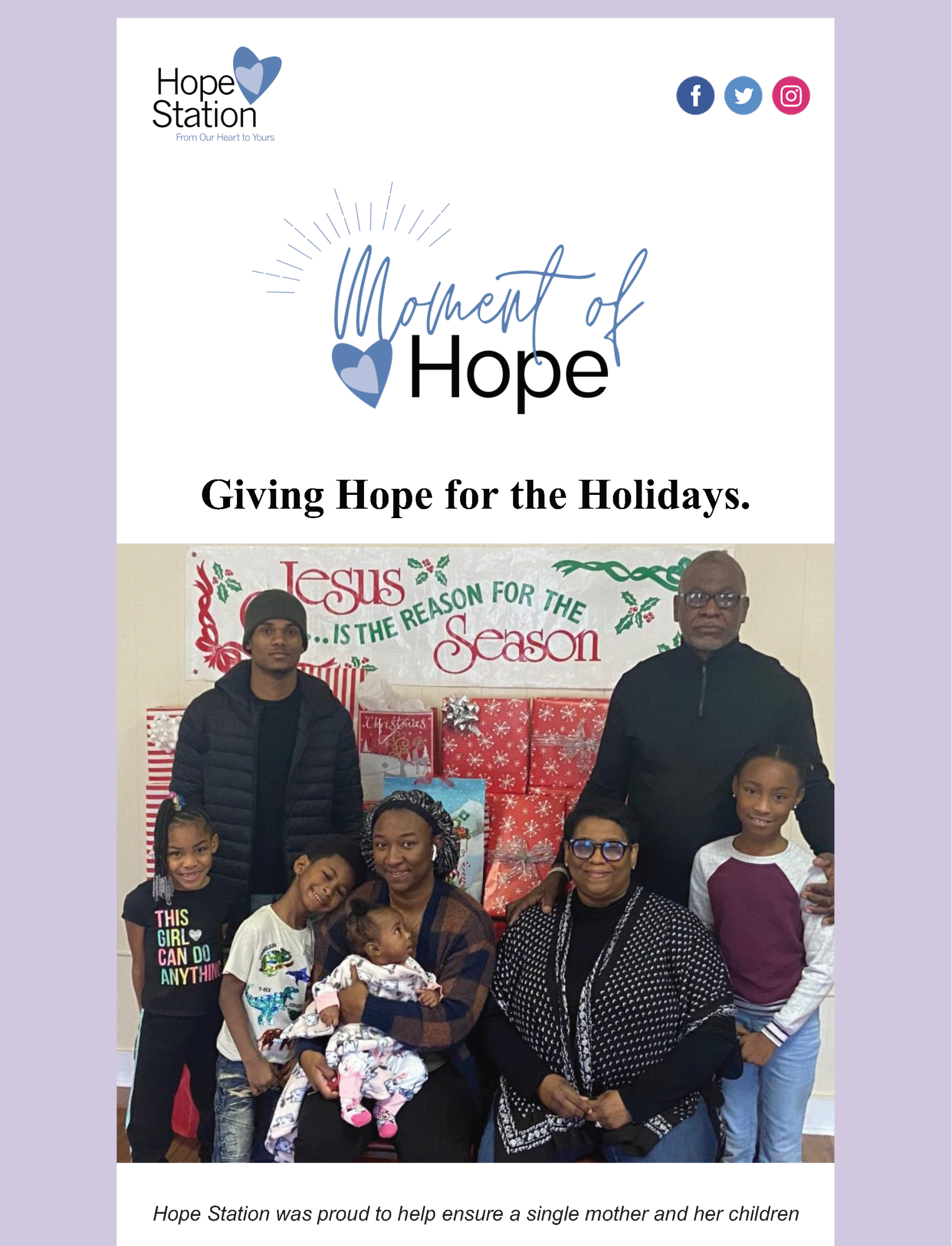 A family is posing for a picture in front of a wall with christmas decorations.