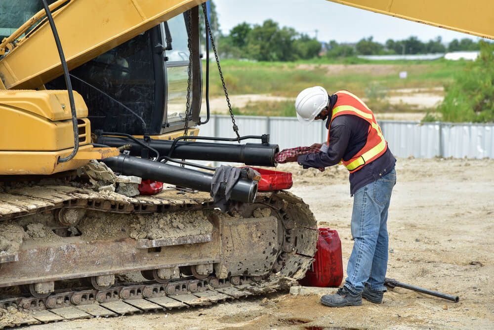 A construction worker is working on a bulldozer on a construction site — Burmec In Narrabri, NSW
