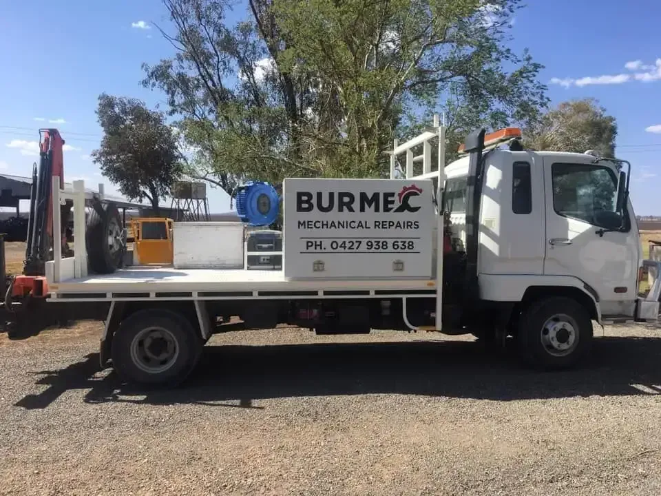 A white truck with a sign that says burmec is parked in a gravel lot — Burmec In Narrabri, NSW